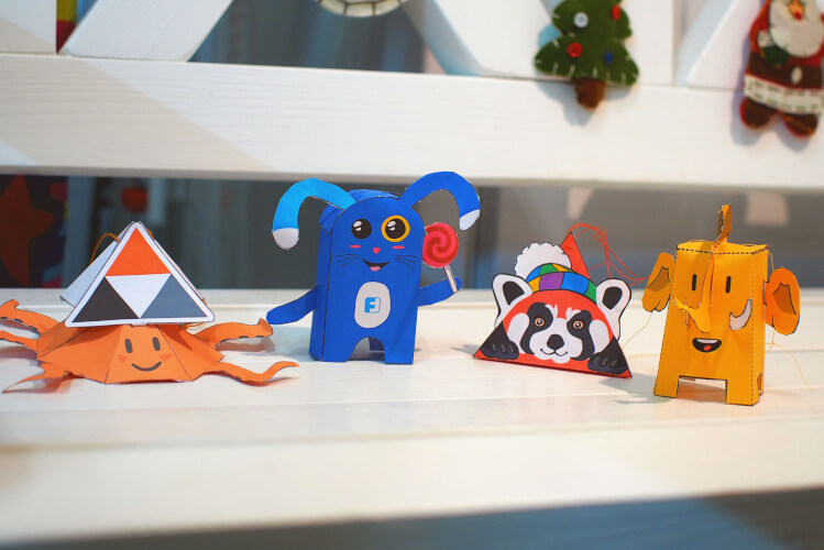 photo of four assembled paper toys